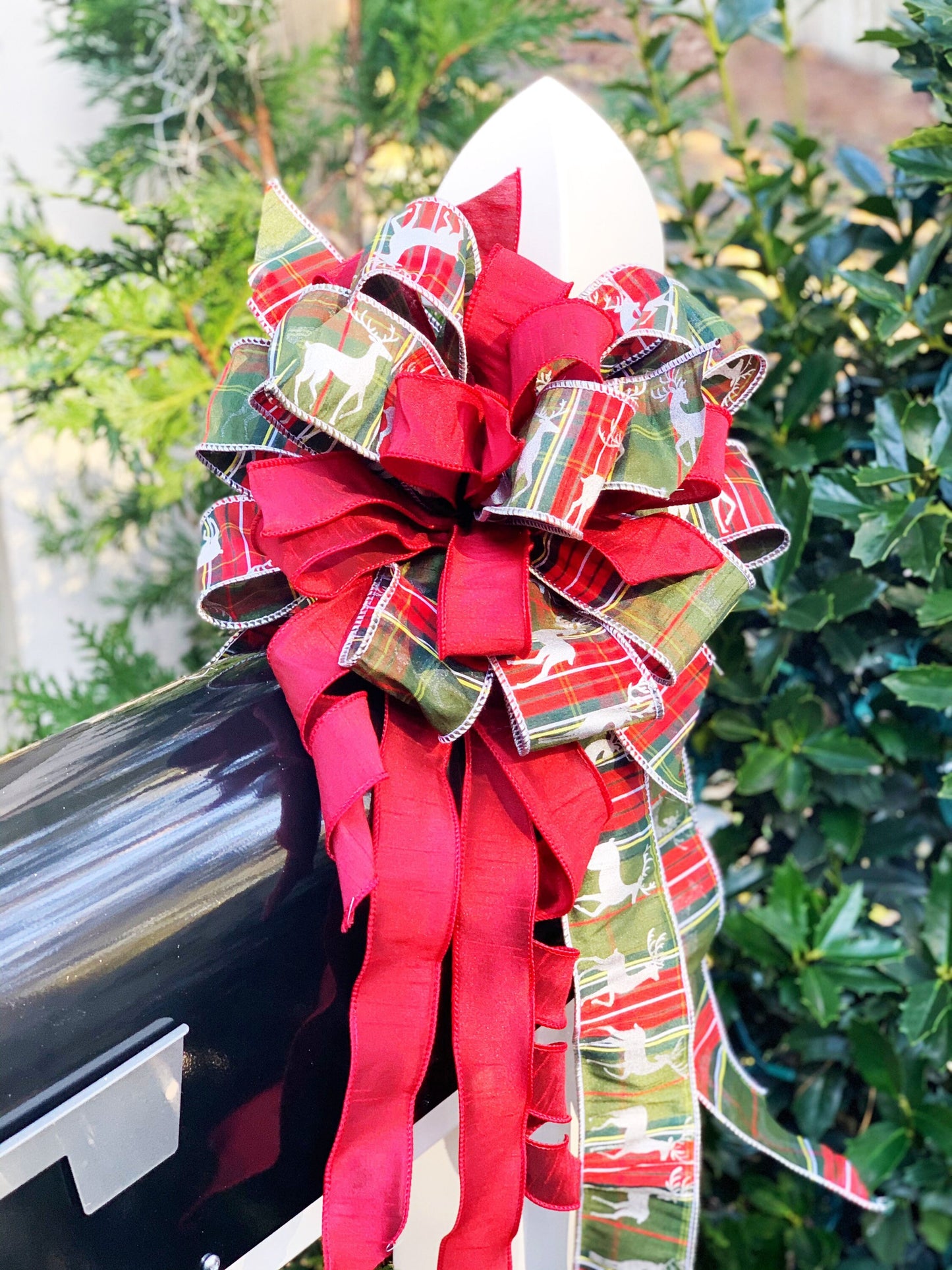 Christmas Bow in Red and Green Multipattern Ribbon Featuring Deer Ribbon. Perfect for Mailbox, Door, and Wreath.