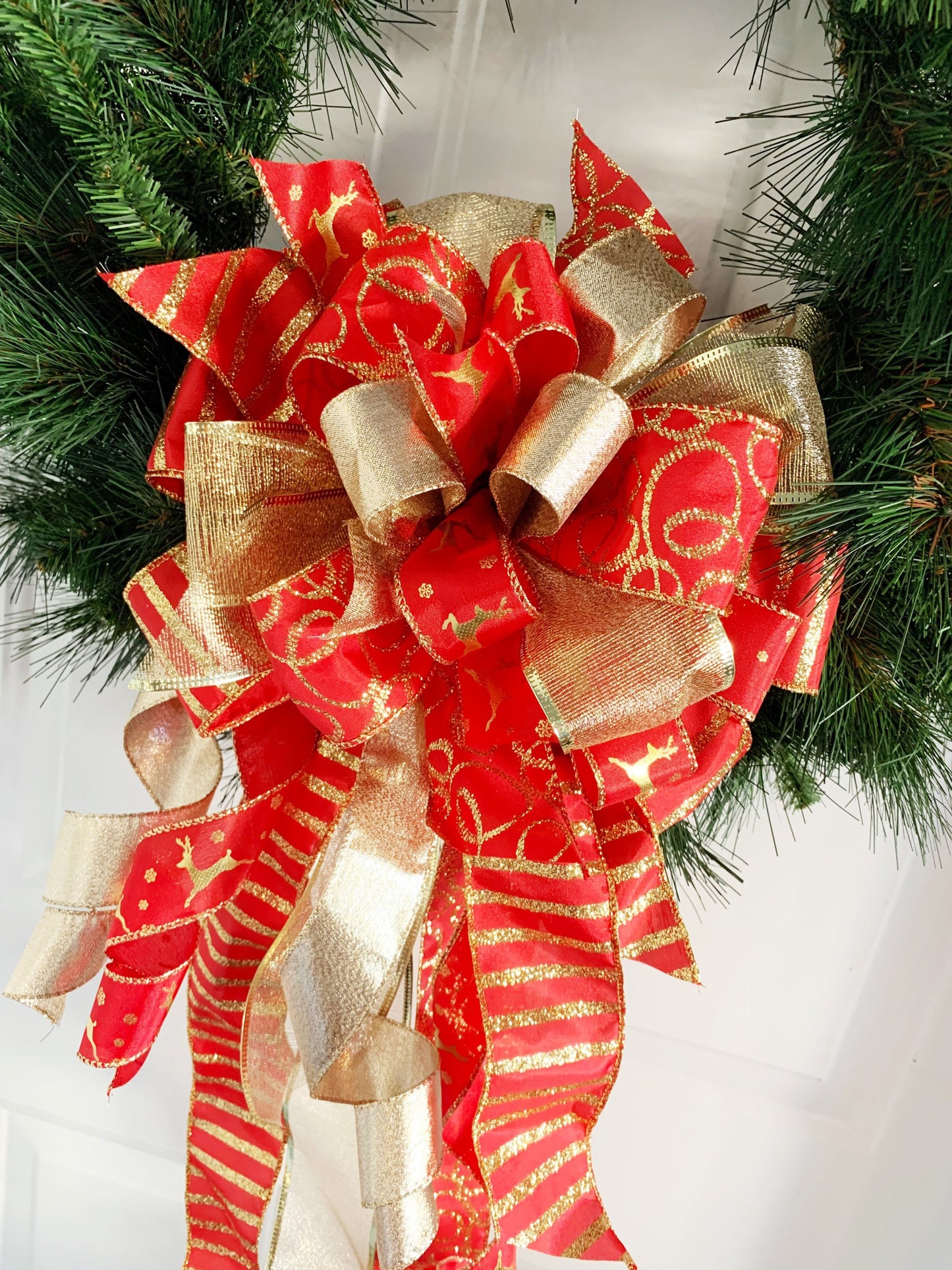 Christmas Bow in Red and Gold Featuring Gold Reindeer Ribbon. Perfect for Mailbox, Door, or Wreath.