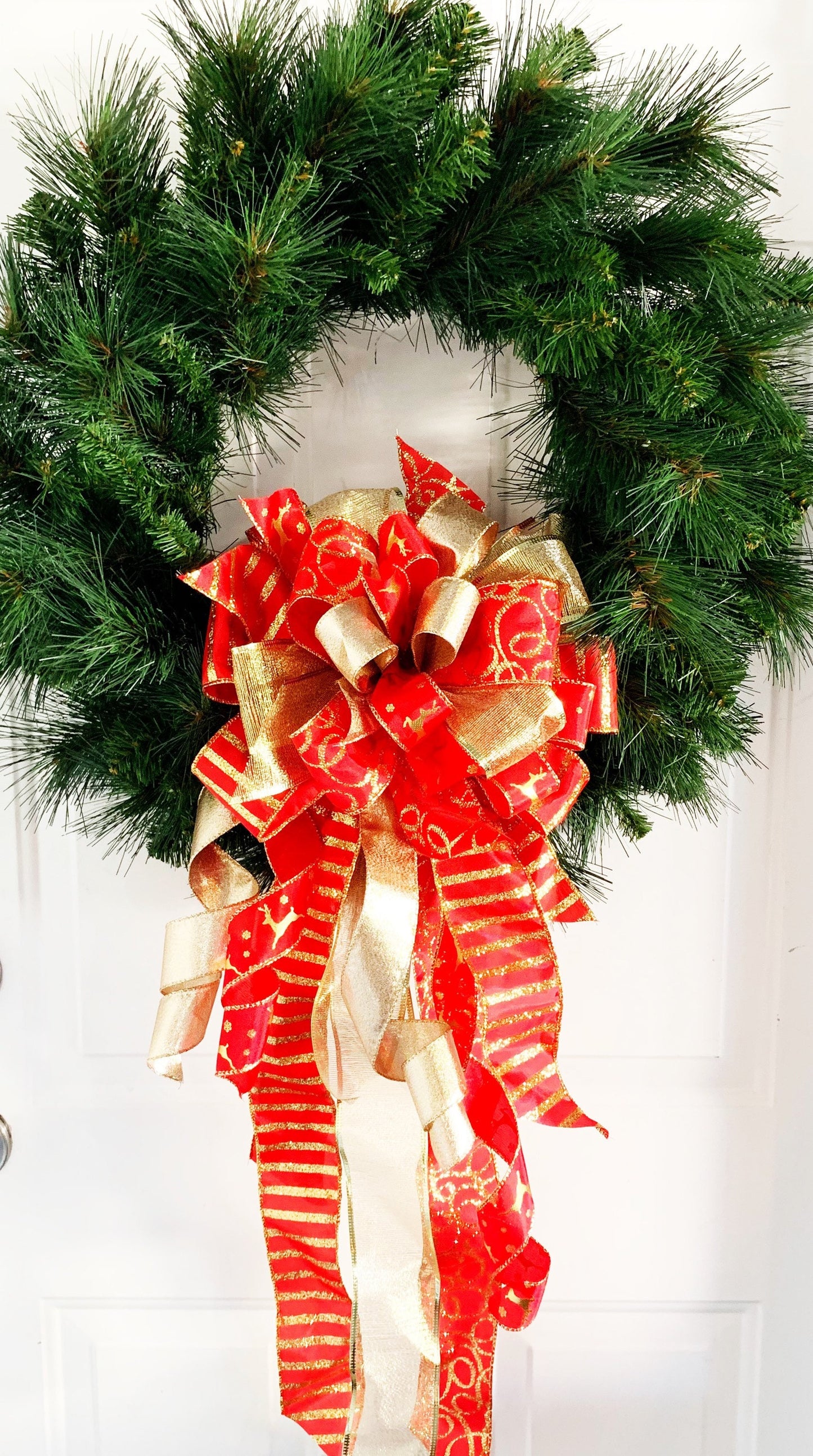 Christmas Bow in Red and Gold Featuring Gold Reindeer Ribbon. Perfect for Mailbox, Door, or Wreath.