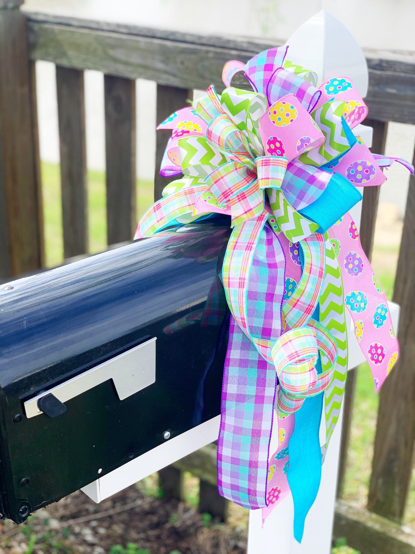 Easter Bow in Light Green and Pink with Multipattern Ribbon Featuring Eggs. Perfect for mailbox, Door, and Wreath.