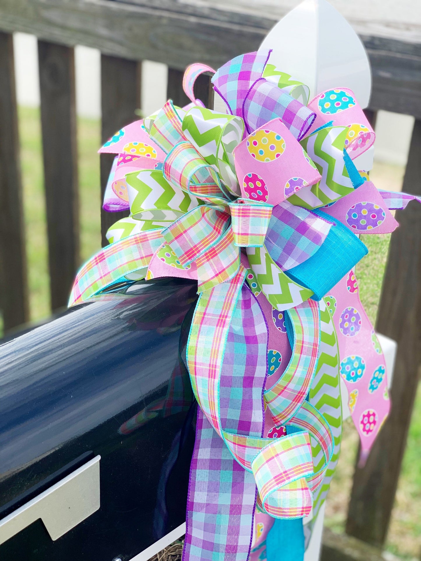 Easter Bow in Light Green and Pink with Multipattern Ribbon Featuring Eggs. Perfect for mailbox, Door, and Wreath.