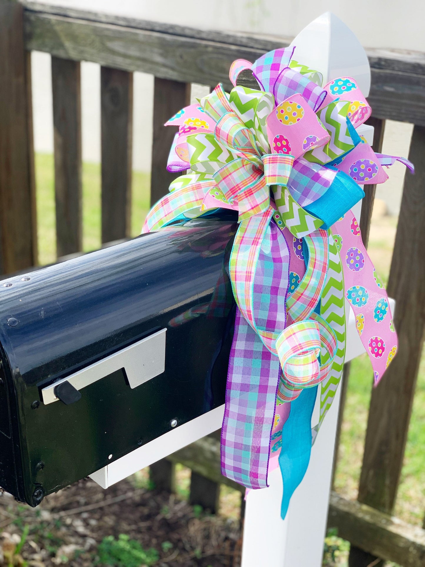 Easter Bow in Light Green and Pink with Multipattern Ribbon Featuring Eggs. Perfect for mailbox, Door, and Wreath.